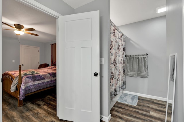 bedroom featuring ceiling fan and dark hardwood / wood-style flooring