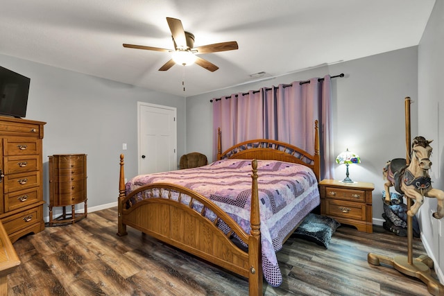 bedroom featuring ceiling fan and dark hardwood / wood-style flooring