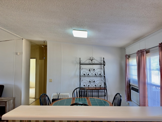 dining area with a textured ceiling