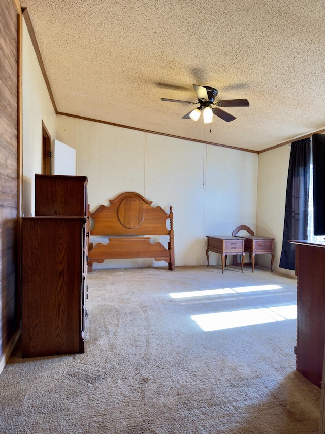 unfurnished bedroom featuring light carpet, ceiling fan, crown molding, and a textured ceiling