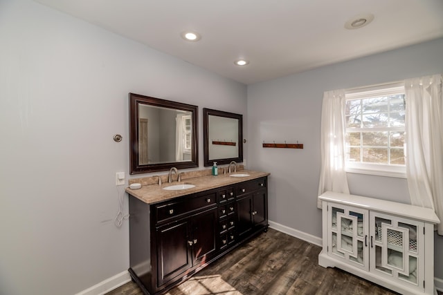 bathroom with vanity and hardwood / wood-style floors