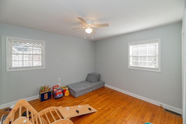 interior space with hardwood / wood-style flooring and ceiling fan