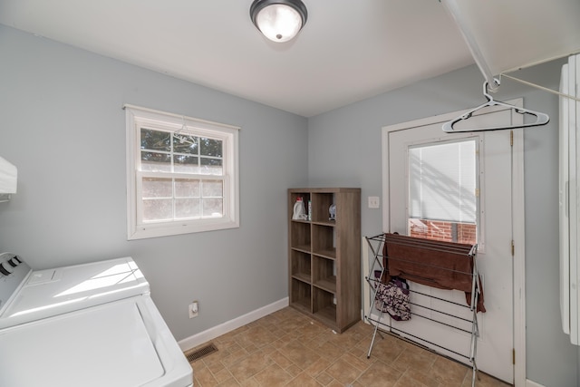 washroom with independent washer and dryer