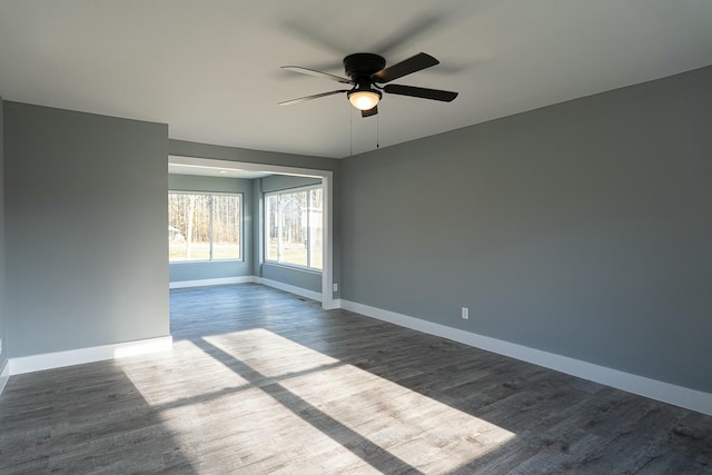 unfurnished room with ceiling fan and hardwood / wood-style floors