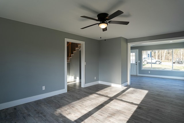 spare room with wood-type flooring and ceiling fan