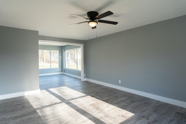 empty room with hardwood / wood-style flooring and ceiling fan