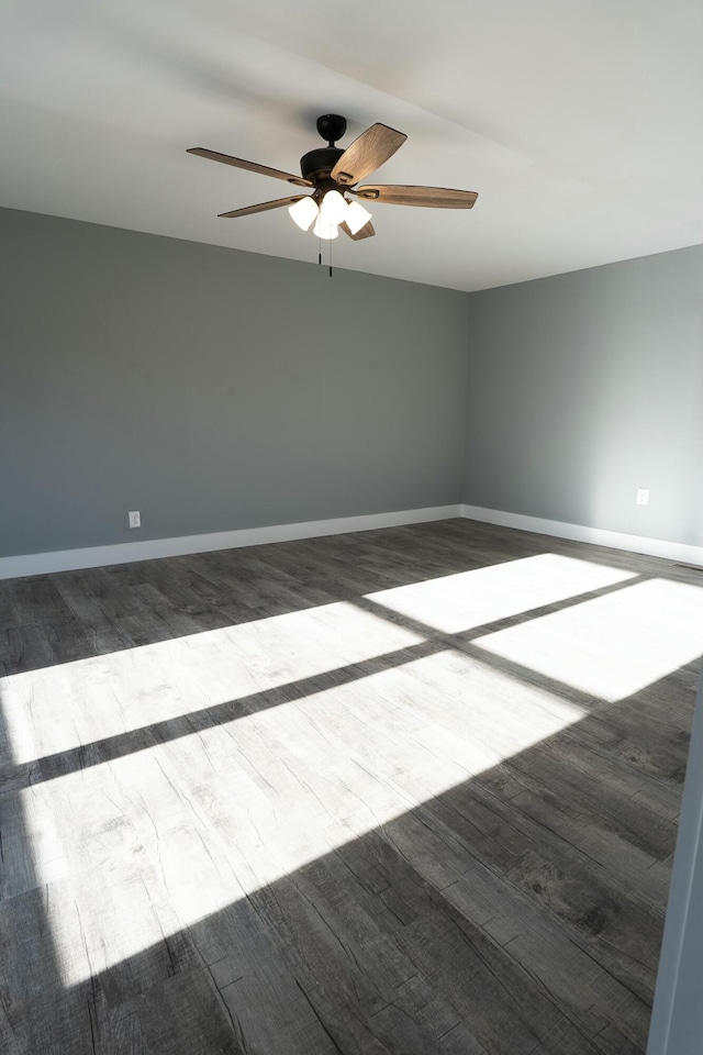 spare room with ceiling fan and hardwood / wood-style flooring