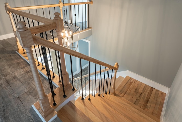 stairs with hardwood / wood-style flooring