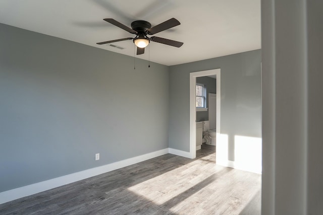 unfurnished room featuring hardwood / wood-style flooring and ceiling fan