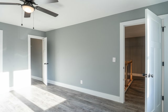 interior space with hardwood / wood-style flooring and ceiling fan