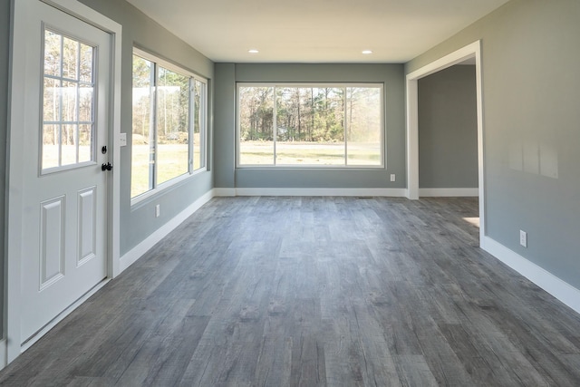 unfurnished sunroom featuring a wealth of natural light