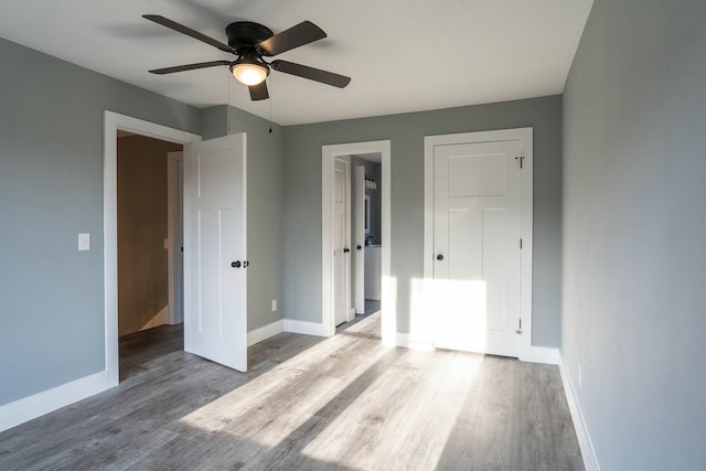 unfurnished bedroom featuring ceiling fan and wood-type flooring