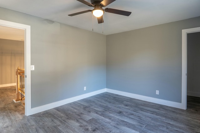 spare room featuring ceiling fan and dark hardwood / wood-style floors