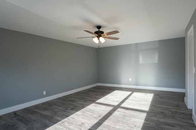 unfurnished room featuring dark hardwood / wood-style floors and ceiling fan