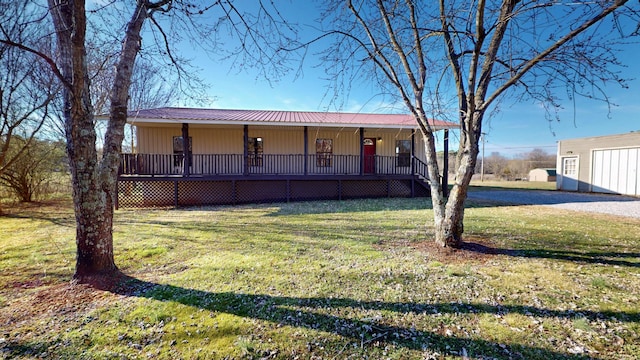 view of front of home with a porch and a front yard