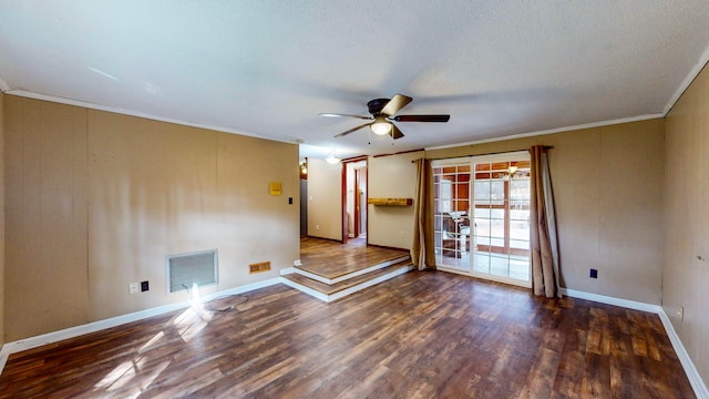 empty room featuring a textured ceiling, ceiling fan, dark hardwood / wood-style floors, and ornamental molding