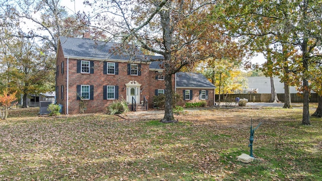 colonial home with central air condition unit