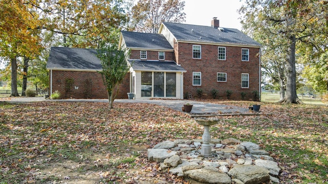 rear view of house featuring a patio