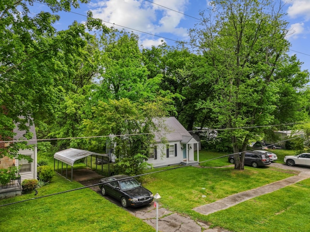 352 W Rhea Ave, Spring City, TN 37381 - view of home's exterior featuring a carport and a yard