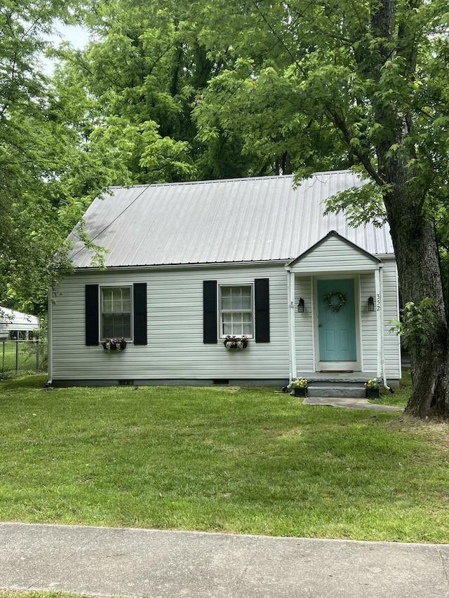 352 W Rhea Ave, Spring City, TN 37381 - view of front facade featuring a metal roof, a front lawn, and crawl space