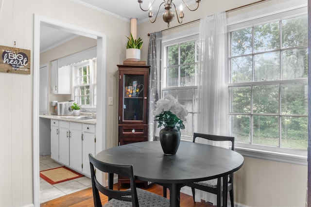 352 W Rhea Ave, Spring City, TN 37381 - dining area featuring crown molding, healthy amount of natural light, a chandelier, and light wood-style flooring