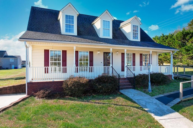 view of front of home with a porch and a front lawn