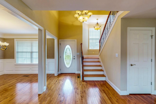 117 Windswept Dr NE, Cleveland, TN 37312 - foyer entrance with a chandelier, healthy amount of natural light, stairway, wainscoting, and ornamental molding