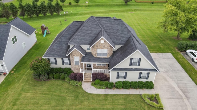117 Windswept Dr NE, Cleveland, TN 37312 - view of front facade with stone siding, a shingled roof, and a front lawn