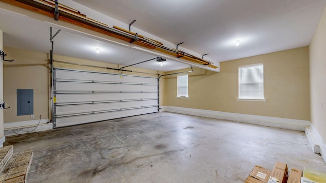 117 Windswept Dr NE, Cleveland, TN 37312 - garage featuring electric panel and a garage door opener