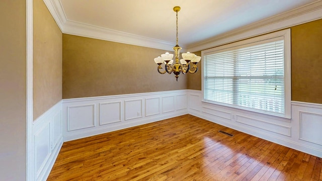 117 Windswept Dr NE, Cleveland, TN 37312 - unfurnished room featuring a chandelier, hardwood / wood-style floors, a wainscoted wall, ornamental molding, and a decorative wall