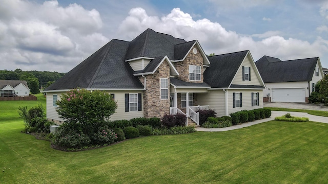 117 Windswept Dr NE, Cleveland, TN 37312 - view of front facade featuring stone siding, a front lawn, and roof with shingles