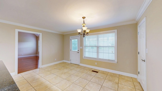 117 Windswept Dr NE, Cleveland, TN 37312 - unfurnished dining area with a chandelier, crown molding, and light tile patterned floors