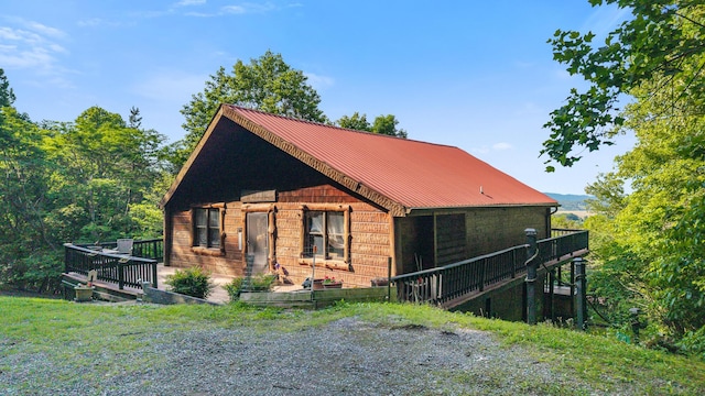 151 Townview Dr, Tellico Plains, TN 37385 - view of front of house with a deck and metal roof