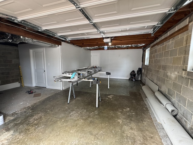1956 Sun Hill Rd SW, Cleveland, TN 37311 - garage featuring concrete block wall and a garage door opener
