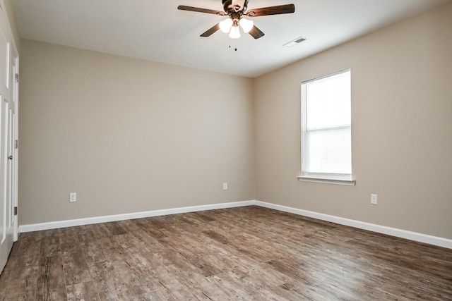 empty room with hardwood / wood-style floors and ceiling fan