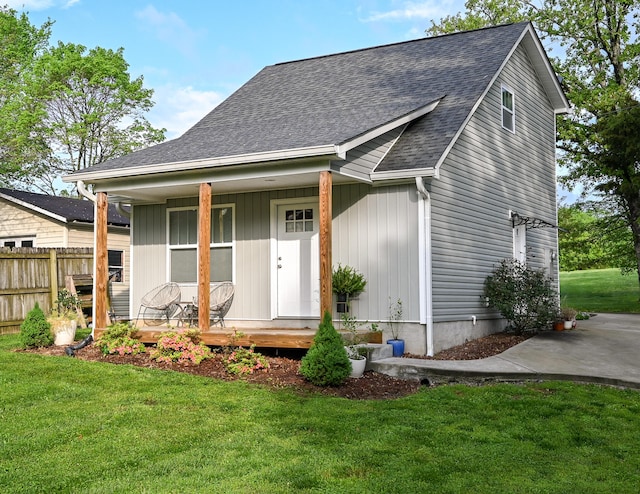 view of front of home with a front yard and a porch