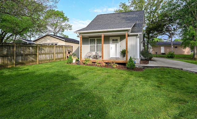 view of front of home featuring covered porch and a front lawn