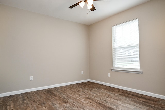 unfurnished room featuring ceiling fan and dark hardwood / wood-style flooring