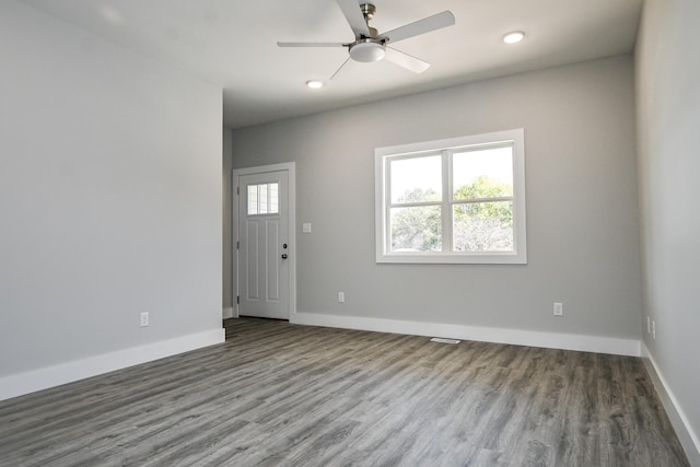 interior space with ceiling fan and hardwood / wood-style flooring