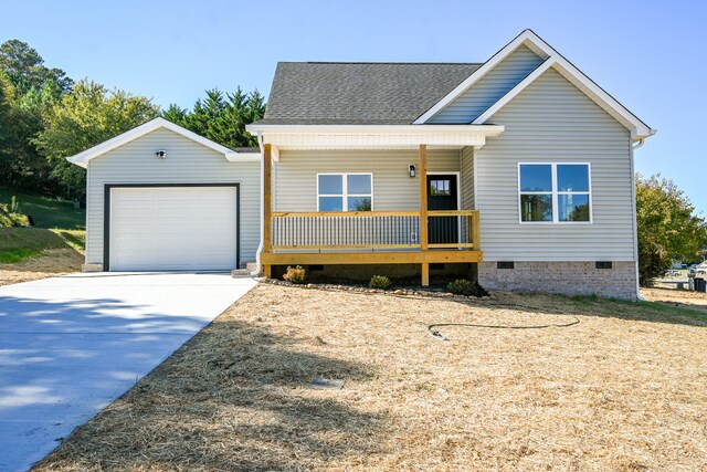 view of front facade featuring a porch and a garage