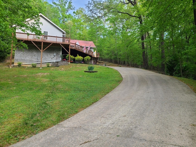 7054 Ski Club Rd, Harrison, TN 37341 - view of green lawn with stairway, a deck, and driveway