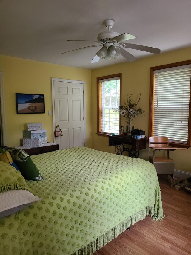 7054 Ski Club Rd, Harrison, TN 37341 - bedroom with wood finished floors and a ceiling fan