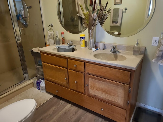 7054 Ski Club Rd, Harrison, TN 37341 - full bath featuring a shower stall, double vanity, wood finished floors, and toilet