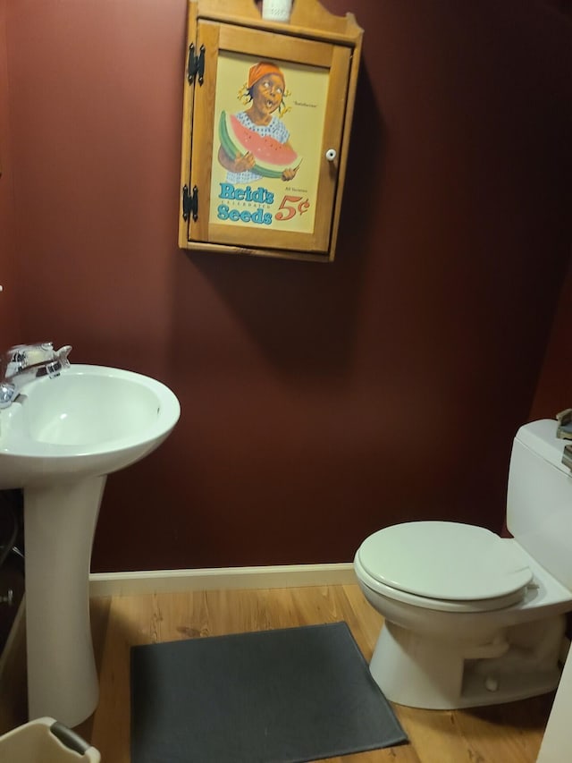 7054 Ski Club Rd, Harrison, TN 37341 - bathroom featuring toilet, baseboards, and wood finished floors