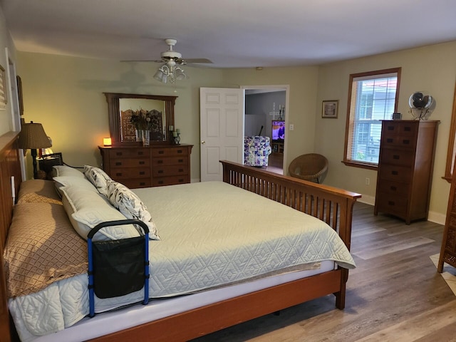 7054 Ski Club Rd, Harrison, TN 37341 - bedroom with wood finished floors, ceiling fan, and baseboards