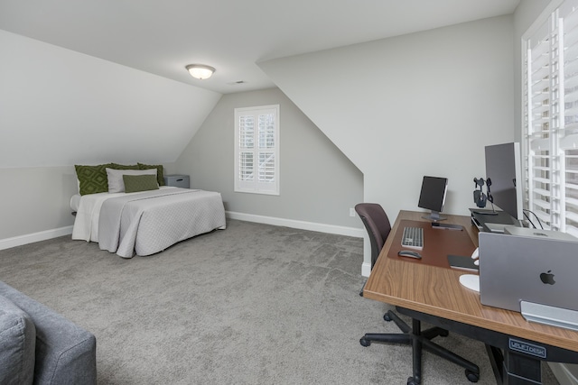 carpeted bedroom with lofted ceiling