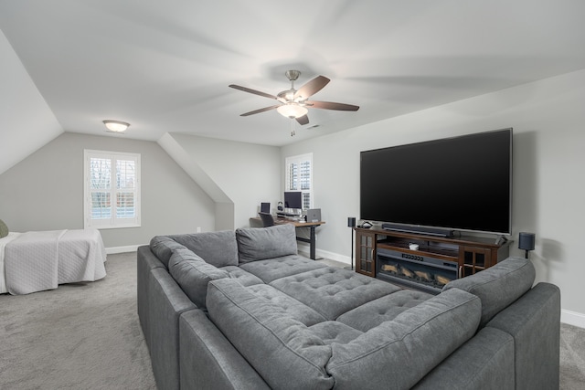 living room featuring carpet, vaulted ceiling, plenty of natural light, and ceiling fan