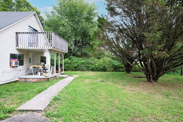 view of yard with cooling unit and a patio