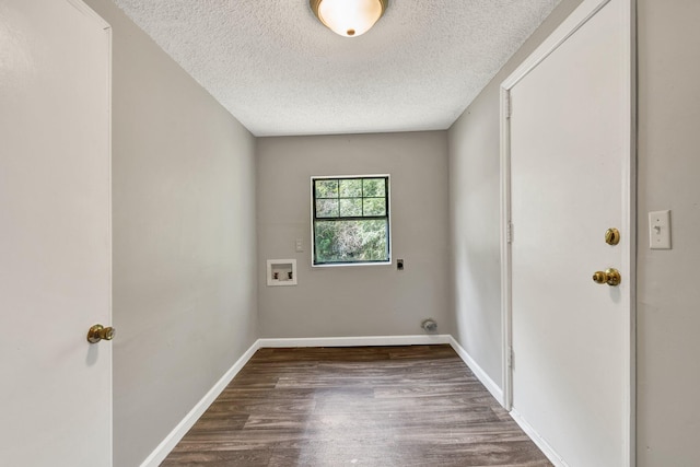 washroom with hookup for a washing machine, laundry area, baseboards, and dark wood-style floors