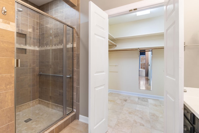 bathroom featuring tile patterned floors and a shower with door